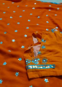 Orange Saree with Star Motifs and Blouse