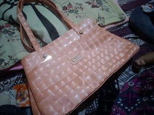 Chic Peach Textured Handbag