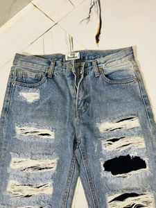 Distressed Blue Denim Jeans
