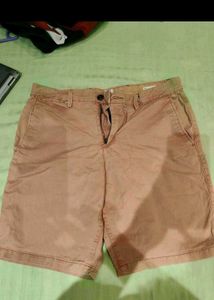 Green Tshirt with Tan shorts