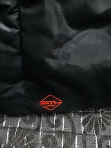 Black Puffer Jacket with Red Accents