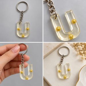 Letter U Keychain with Gold Pearls