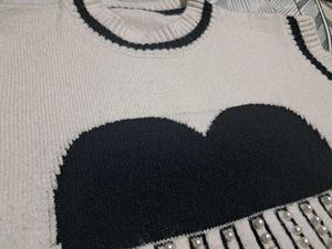 Chic Sleeveless Sweater Vest with Heart Design