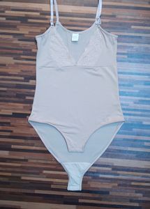 Elegant Nude Bodysuit With Lace Neck Line