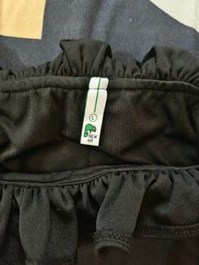 Black Ruffle Tube Bodysuit From NEWME