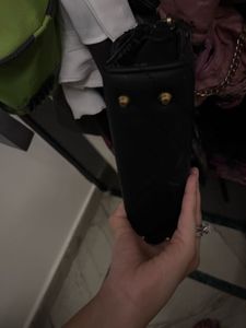 black sling bag puffed and spacious