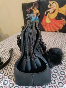 Stylish Black Handbag with Fur Pom-Pom