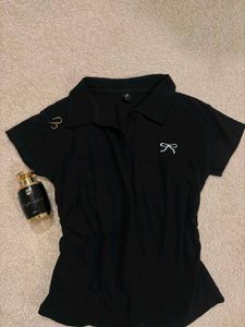 Chic Black Polo Shirt with Bow Detail
