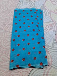Blue Saree With Red And Some White Dots.
