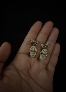 Gold Tone Bow Egg Dangle Earrings
