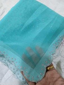 Elegant Teal Saree suitable for parties..