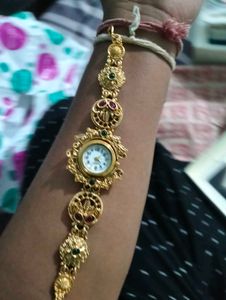 Exquisite Gold Tone Watch with Gemstones