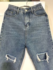 Distressed Blue Denim Jeans