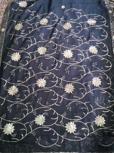 Elegant Black Saree with Gold Embellishments