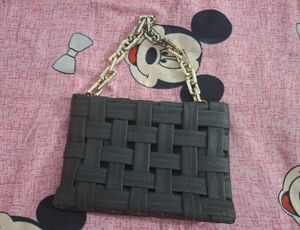 Chic Woven Black Handbag with Gold Chain