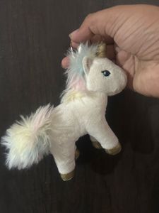 This white unicorn plush keychain features a shim