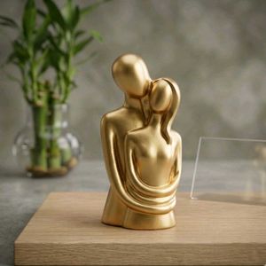 Golden Couple Hugging Sculpture