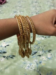 Elegant Gold-Toned Bangle Set with Leaf Charms