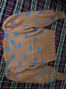 Tan color sweater top with blue dots