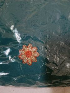 Elegant Teal Saree with Floral Embroidery