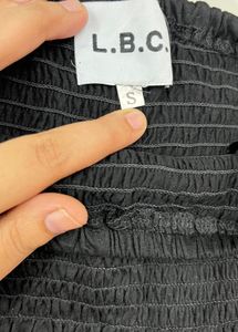 Chic Black Smocked Peplum Tube Top