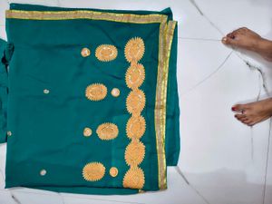 Elegant Teal Saree with Golden Embroidery
