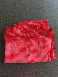 Stunning red tie-dye saree with unique embellishme