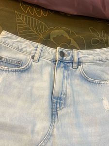Light Wash Distressed Denim Skirt