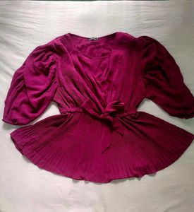 A beautiful decent purple top with florry sleeves