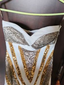 Cleopatra off-shoulder dress.