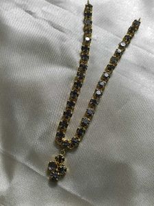 Elegant Gold Chain with Dark Stones