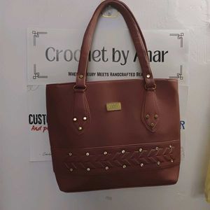 Stylish Brown Handbag with Embellishments