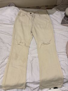 Cream Distressed Flare Jeans