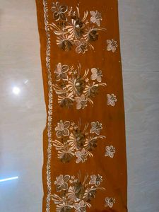 Vibrant Orange Saree with Embellishments