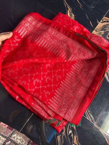 Vibrant Red Saree with Intricate Silver Weave