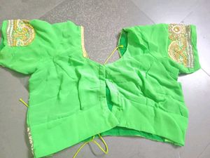 Vibrant Green Embroidered saree with stitched blou