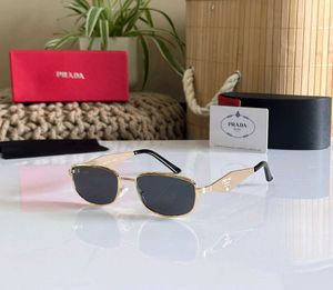 Prada Sunglasses - Gold Frame