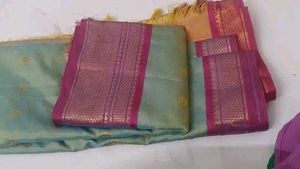 Elegant Pastel Green Saree with Pink Border