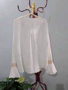 Elegant White V-Neck Blouse with Bell Sleeves