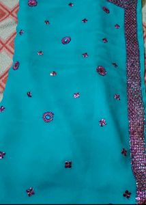 Teal Saree with Floral Embellishments