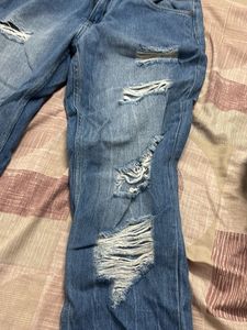 Distressed Blue Denim Jeans