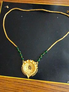 Elegant Gold Necklace with Green Beads