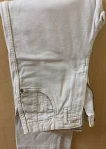 Cream straight leg jeans