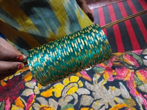 Elegant Green Glass Bangles with Gold Accents