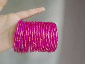 Vibrant Pink Bangles with Gold Accents