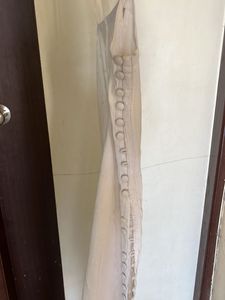 white sleeveless kurta with pink stripped pants