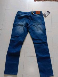Stylish Men's Ripped Blue Jeans branded with tag
