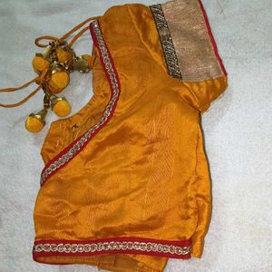 mustard yellow colour blouse with heavy latkan.