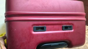 Maroon Hard Shell Luggage Handel grip is broken