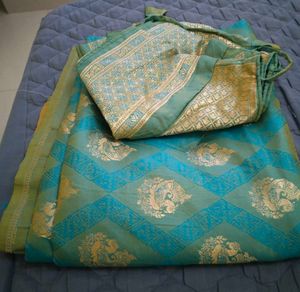 Elegant Teal Saree with Gold Brocade